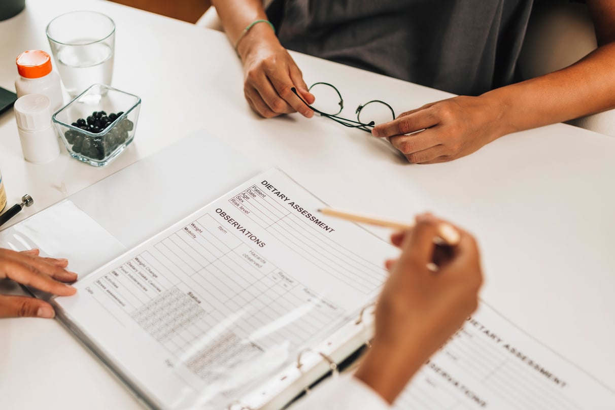 Dietary Assessment Form. Female Nutritionist Working With A Client